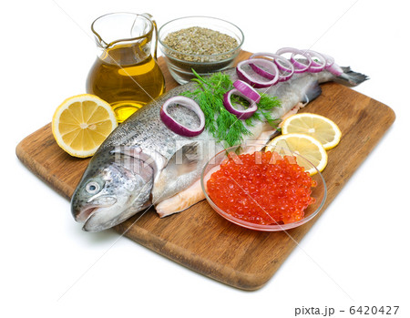 trout, vegetables, spices and red caviar on white background 6420427