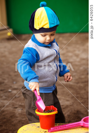 Boy Playing in Sandbox Boy Playing in Sandbox 6426055
