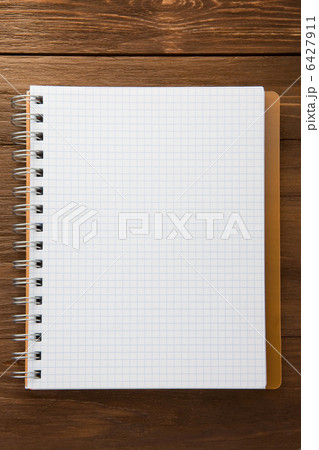 checked notepad on wood checked notepad on wood 6427911