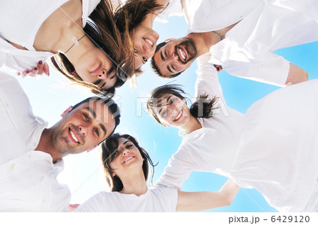 Group of happy young people in circle at beach Group of happy young people in circle at beach 6429120