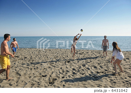 young people group have fun and play beach volleyball young people group have fun and play beach volleyball 6431042
