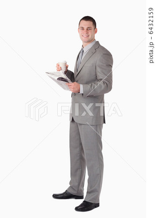 Portrait of a businessman holding a cup of coffee while reading Portrait of a businessman holding a cup of coffee while reading 6432159