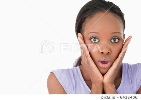 Close up of frightened woman on white background Close up of frightened woman on white background 6433406