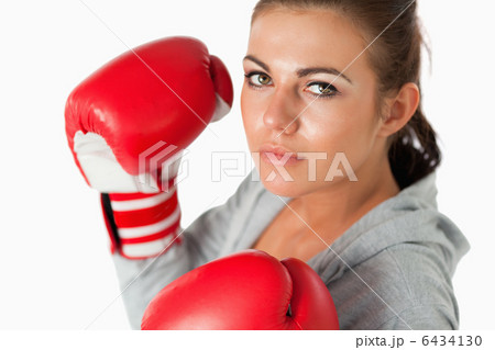Cute woman with boxing gloves Cute woman with boxing gloves 6434130