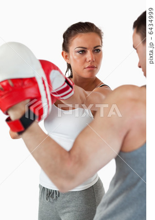 Young woman listening to her trainer Young woman listening to her trainer 6434999