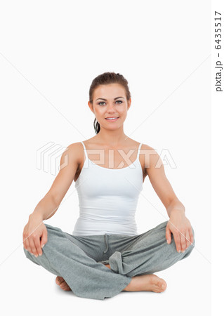 Portrait of a woman in the Sukhasana position 6435517