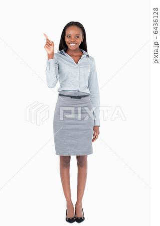 Portrait of a businesswoman pointing at something Portrait of a businesswoman pointing at something 6436128