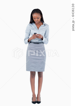 Portrait of a businesswoman sending a text message 6436130