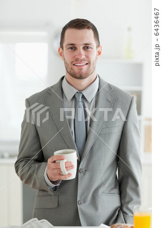 Portrait of a businessman having breakfast Portrait of a businessman having breakfast 6436467