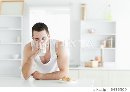 Serene man having breakfast Serene man having breakfast 6436509