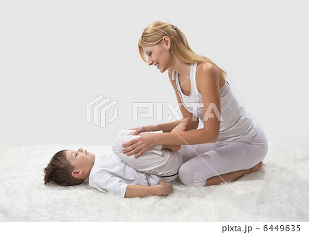 Mother and son do yoga before bed Mother and son do yoga before bed 6449635