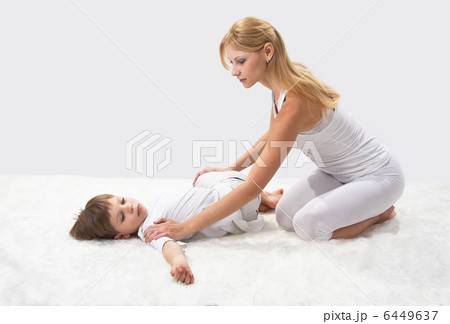 Mother and son do yoga before bed Mother and son do yoga before bed 6449637