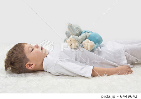 Childrens yoga. Yoga before a sleeping. The kid with a favourit 6449642
