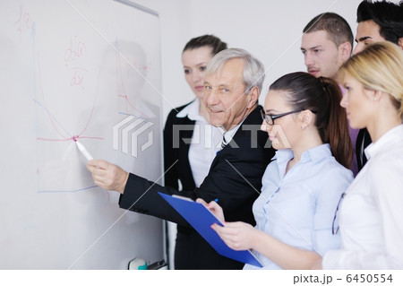 Senior business man giving a presentation Senior business man giving a presentation 6450554