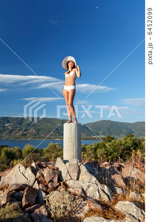 Young woman in white bikini Young woman in white bikini 6452099