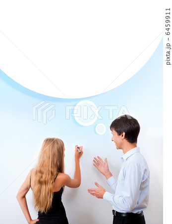 Confident adult teacher helping to students in school classroom Confident adult teacher helping to students in school classroom 6459911
