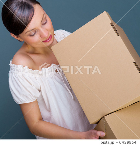 Closeup portrait of a young woman with boxes 6459954