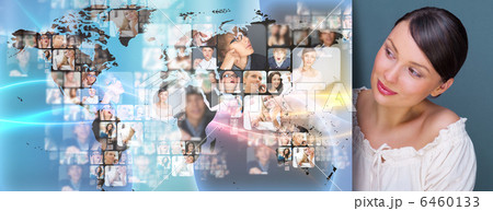 Portrait of young woman standing near big virtual display with w 6460133