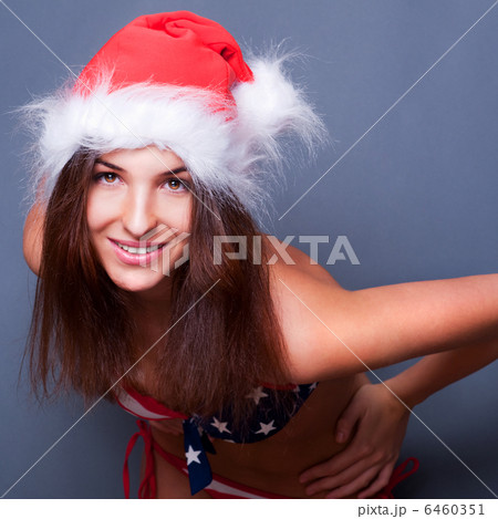 20-25 years old beautiful woman in christmas hat and swimsuit wi 20-25 years old beautiful woman in christmas hat and swimsuit wi 6460351