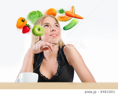 Young beautiful woman with vegetables, berries and fruits flying 6461001