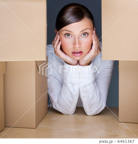 Portrait of young woman surrounded by lots of boxes. Lots of wor Portrait of young woman surrounded by lots of boxes. Lots of wor 6461367