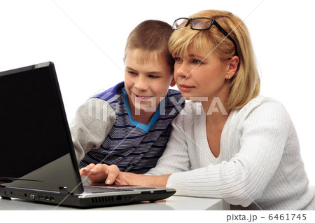 Portrait of adult woman watching as her son doing homework Portrait of adult woman watching as her son doing homework 6461745
