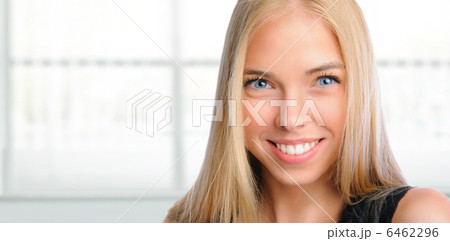 Young beautiful woman smiling at office. Standing against window Young beautiful woman smiling at office. Standing against window 6462296