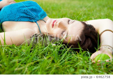 Pretty brunette girl wearing elegant dress relaxing outdoor in g 6462758