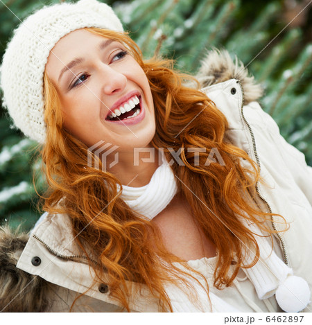 Portrait of young pretty woman in winter park 6462897