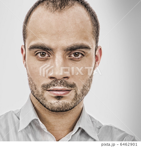 Fashion portrait of adult handsome business man looking at camer 6462901
