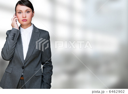 Portrait of beautiful business woman on the phone at her office 6462902