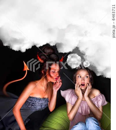 Young woman sitting at home and seductive devil coming to her an 6463711