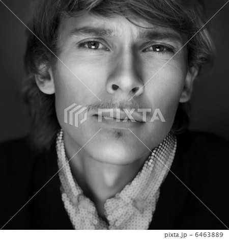 Portrait of young man with smart and wise look. Looking at camer Portrait of young man with smart and wise look. Looking at camer 6463889