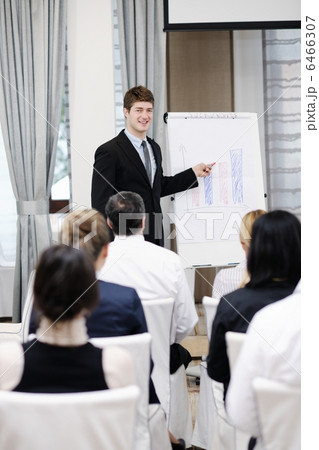 Young business man giving a presentation on conference 6466307