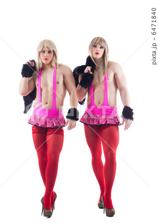 Two transvestites in pink costumes isolated 6471840
