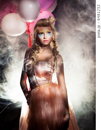 Beautiful Princess in Pink Dress with Golden Crown. Haze 6481252
