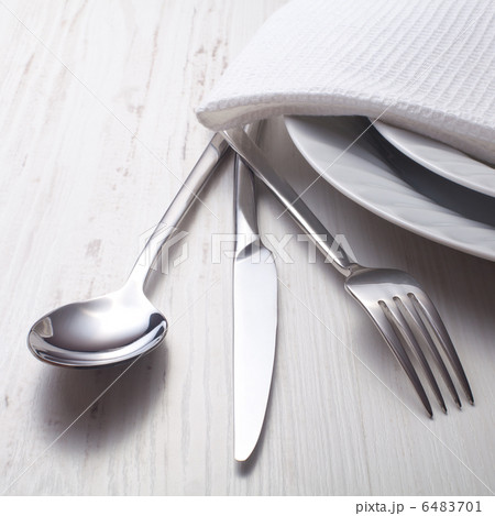 fork, knife, spoon and a white plate 6483701