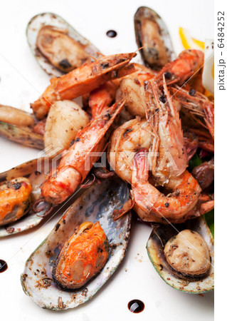 mussels and shrimp prepared on plate 6484252