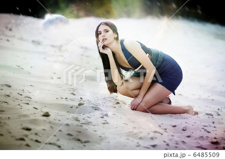Sexual woman in blue dress on the cosmic beach sand Sexual woman in blue dress on the cosmic beach sand 6485509