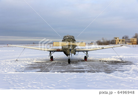 Propeller plane parking at the airport in winter Propeller plane parking at the airport in winter 6496948
