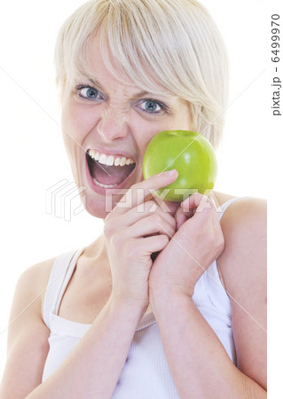 happy young woman eat green apple isolated on white 6499970