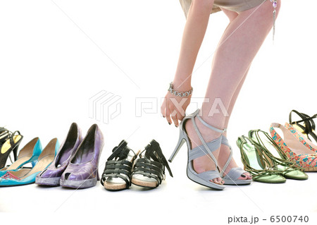 pretty young woman with buying shoes addiction, isolated on whit pretty young woman with buying shoes addiction, isolated on whit 6500740