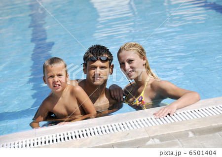 happy young family have fun on swimming pool 6501404