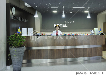 smiling businesswoman at the reception desk smiling businesswoman at the reception desk 6501861