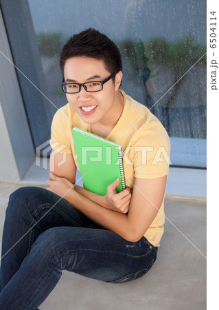 Student sitting on floor 6504114
