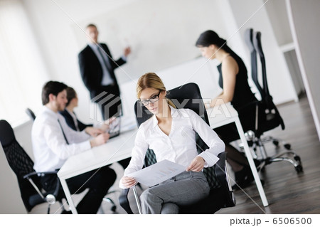 business woman with her staff in background 6506500