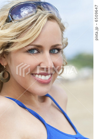 Beautiful Young Blond Woman Smiling At The Beach 6509647
