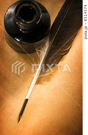 Feather ink bottle on paper Feather ink bottle on paper 6514574
