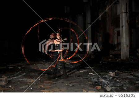Woman holds in his hand the fire 6516205