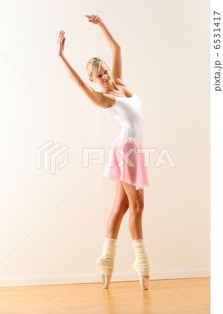 Beautiful ballet dancer practicing dance posture 6531417